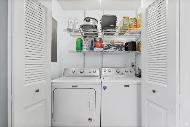 a kitchen with refrigerator a stove and cabinets