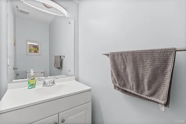 a bathroom with a sink and a window