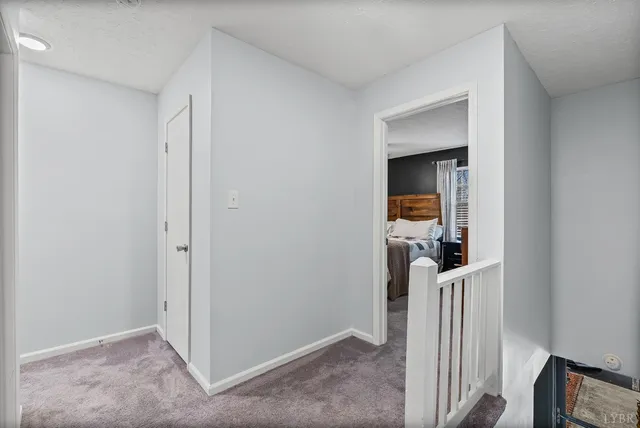 a view of a livingroom with a hall and an entryway