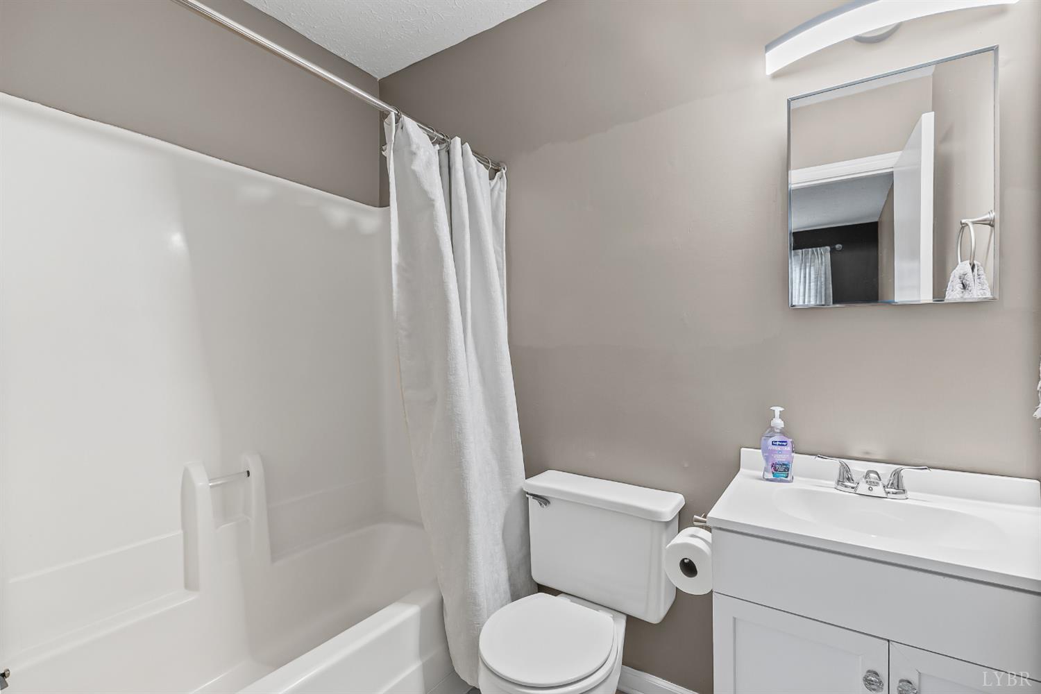 20 Cape Henry Court Lynchburg, VA 24502 - Photo 20 of 34 a white toilet sitting next to a bathroom sink