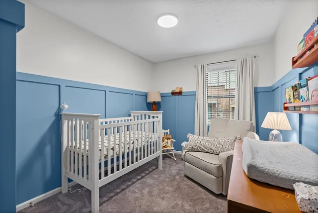 a bedroom with furniture and a window