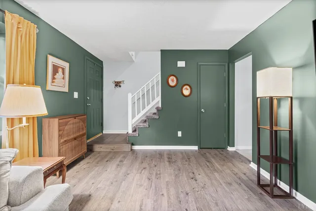 a view of a livingroom with furniture and a window