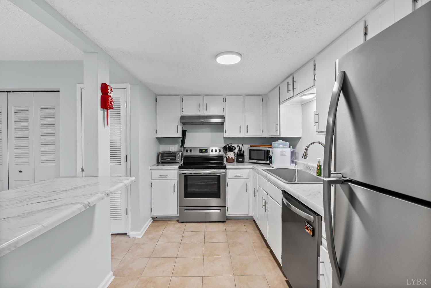 20 Cape Henry Court Lynchburg, VA 24502 - Photo 5 of 34 a kitchen with stainless steel appliances granite countertop a sink and cabinets