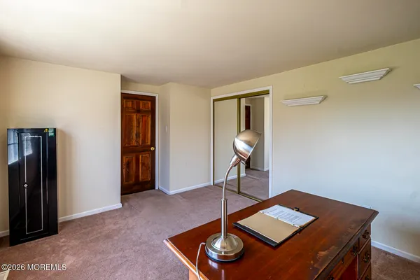a work room with furniture and wooden floor