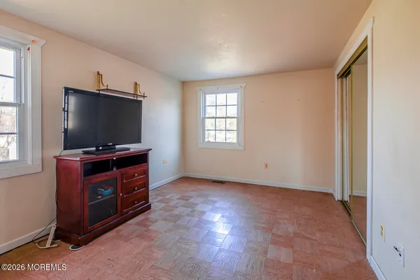 a room with furniture and flat screen tv