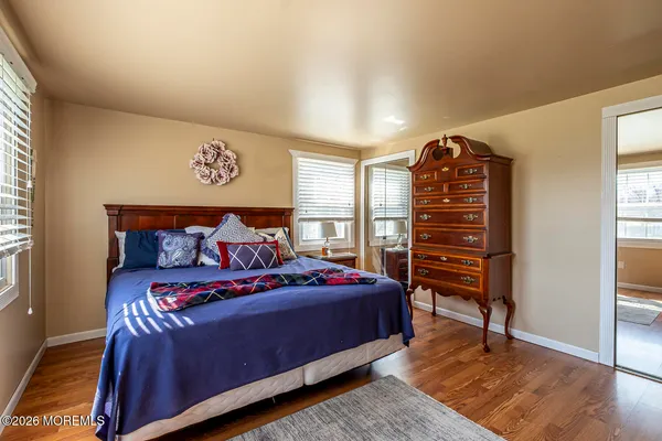a bedroom with a bed and a closet