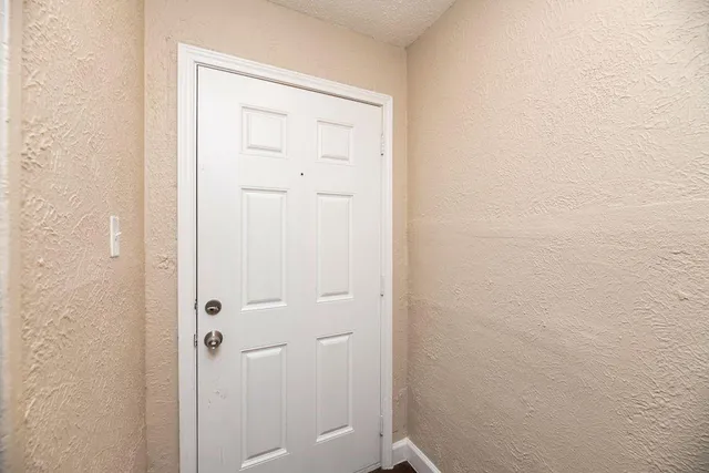 a kitchen with stainless steel appliances granite countertop a stove a refrigerator and a sink