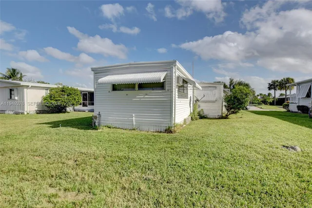 a view of a backyard of the house