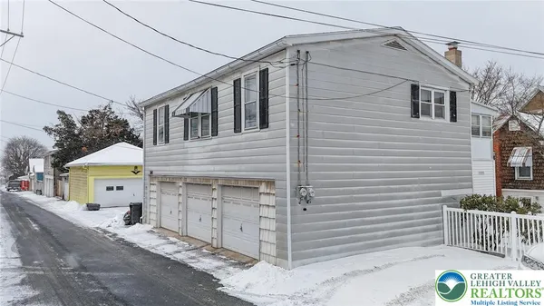 a front view of a house with a garage