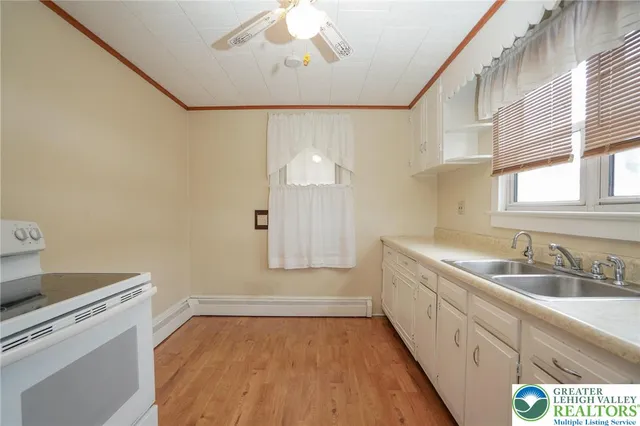 a bathroom with a sink a mirror and a bathtub
