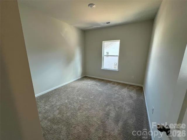 en empty room with windows