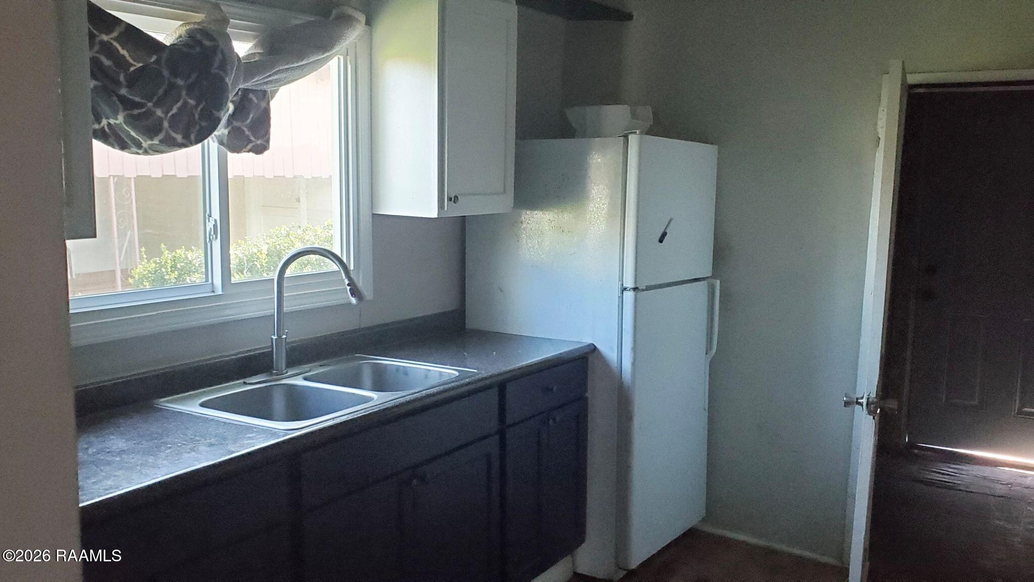 100 13th Street Lafayette, LA 70501 - Photo 2 of 5 Kitchen to Laundry Room