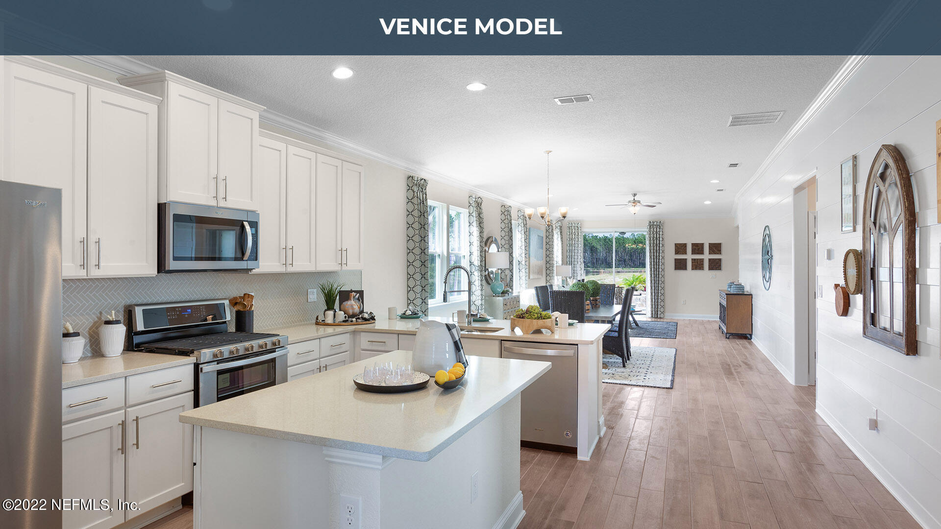 199 Thistleton Way St. Augustine, FL 32092 - Photo 11 of 42 a kitchen with stainless steel appliances a stove a sink a microwave a refrigerator and cabinets