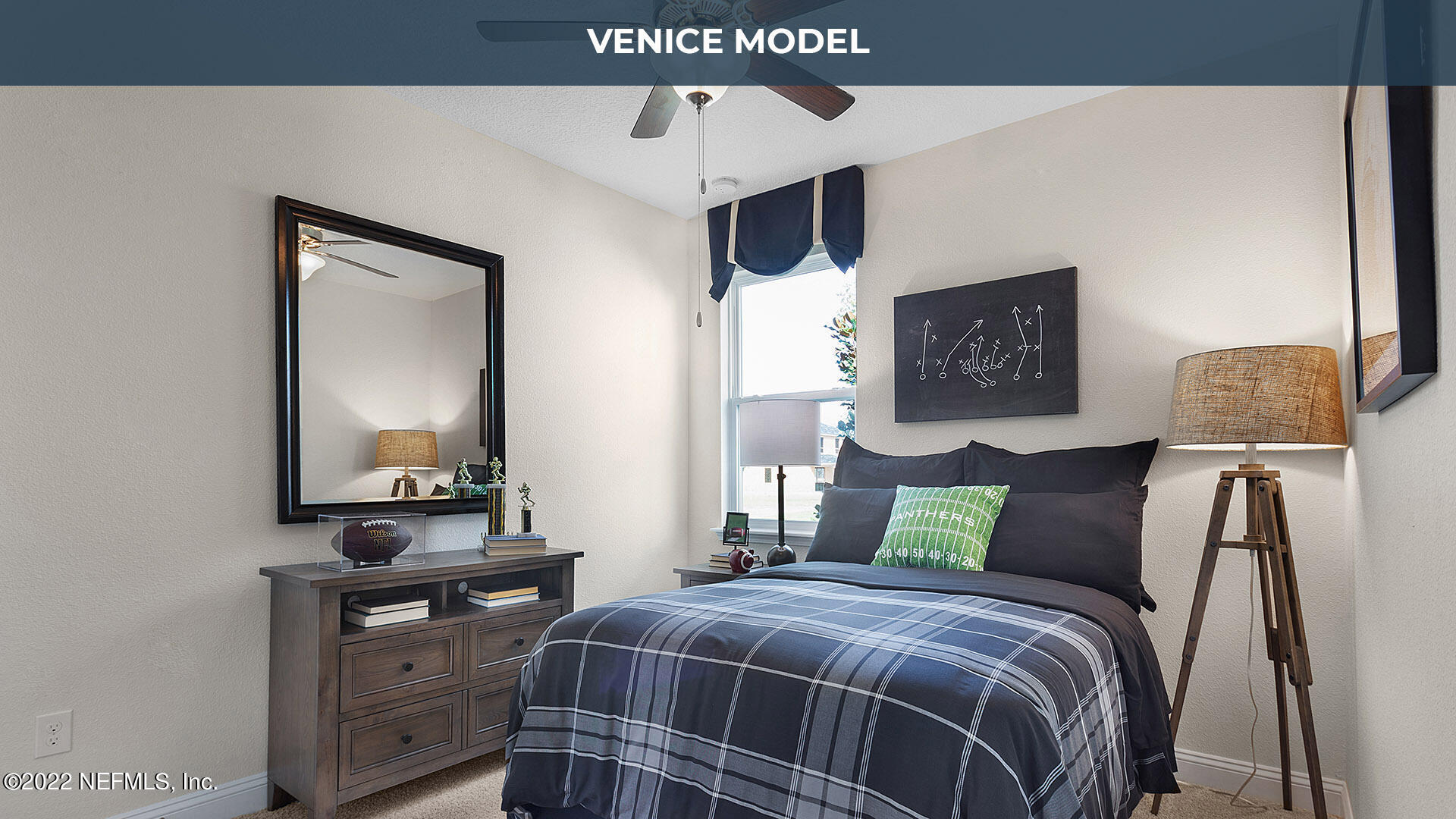 199 Thistleton Way St. Augustine, FL 32092 - Photo 14 of 42 a bedroom with a bed a mirror on dresser and a table