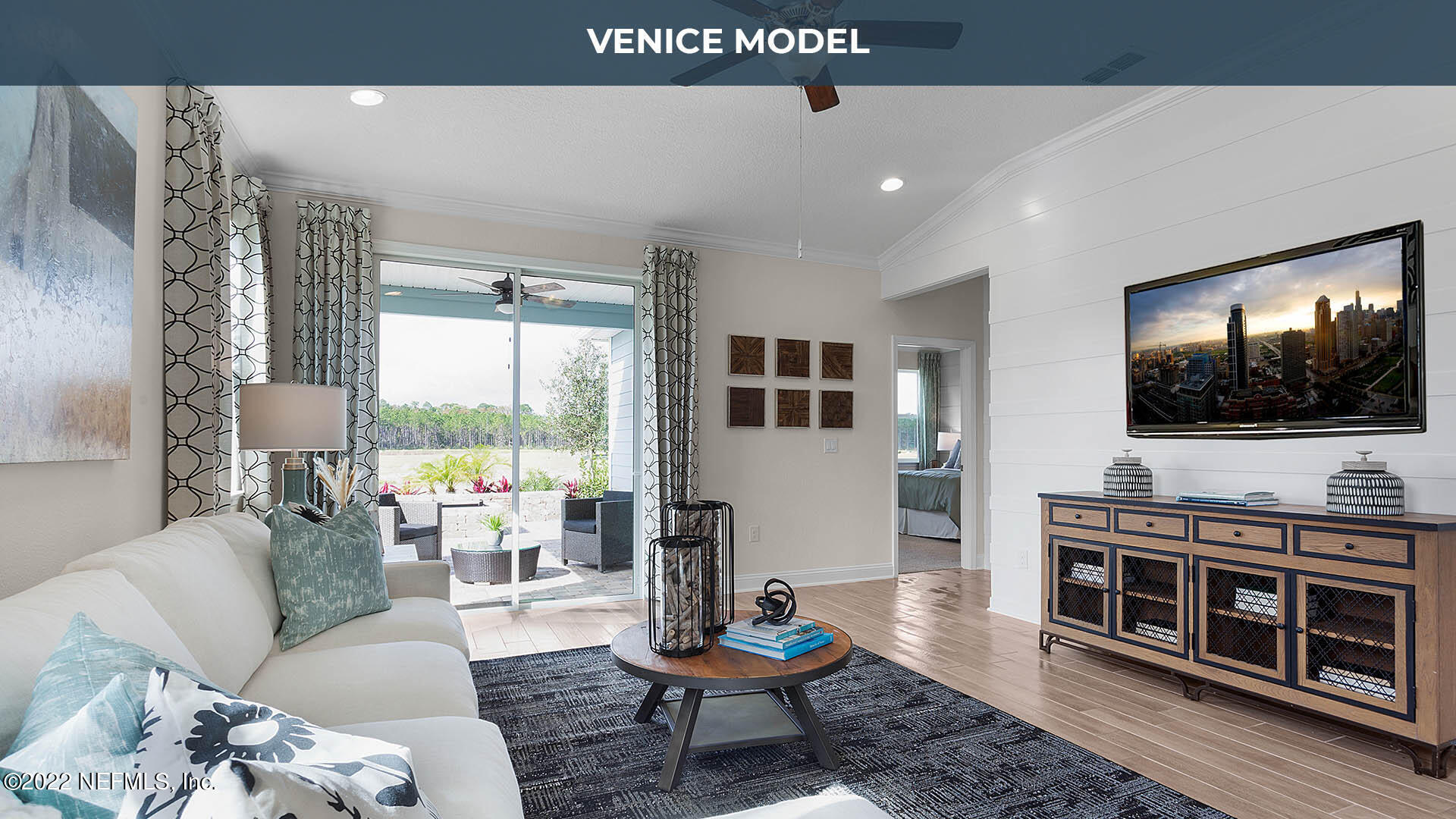 199 Thistleton Way St. Augustine, FL 32092 - Photo 7 of 42 a living room with furniture and a flat screen tv