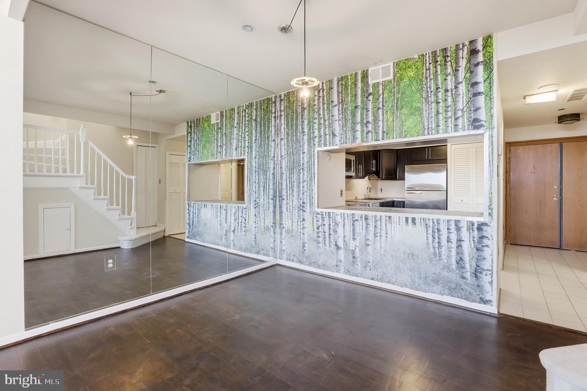 1301 North Courthouse Road, Unit 1804 Arlington, VA 22201 - Photo 13 of 29 a view interior of a house with wooden floor fireplace and windows