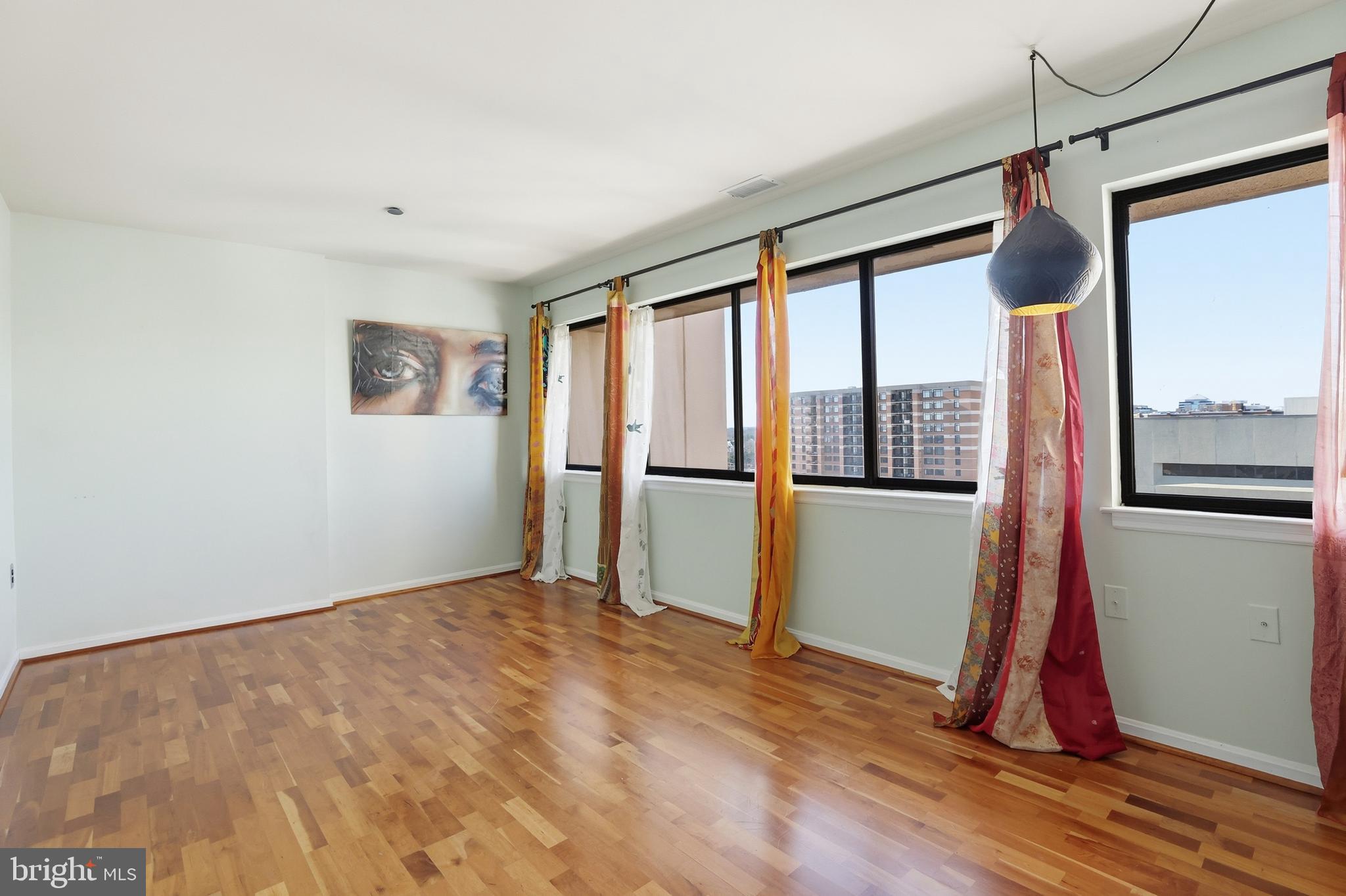 1301 North Courthouse Road, Unit 1804 Arlington, VA 22201 - Photo 22 of 29 a view of a room with window and wooden floor
