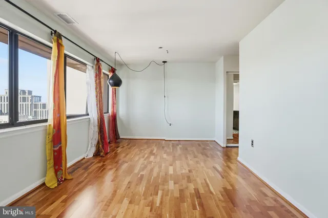 a view of an entryway with wooden floor