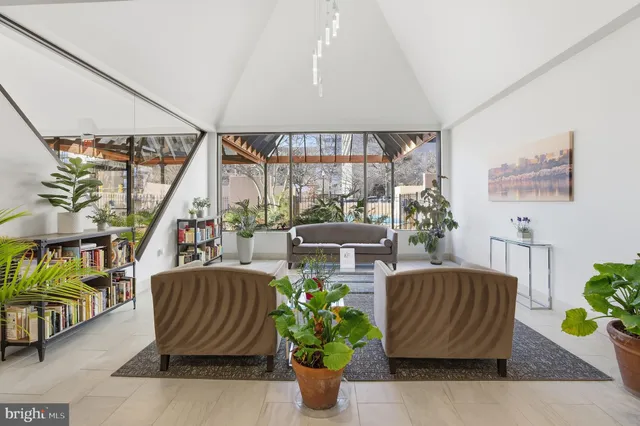 a bathroom with a shower and a glass door