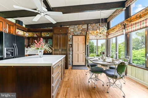 a kitchen with stainless steel appliances granite countertop a sink and cabinets