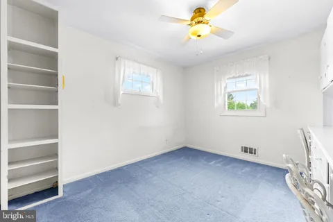 a view of a chair and cabinets