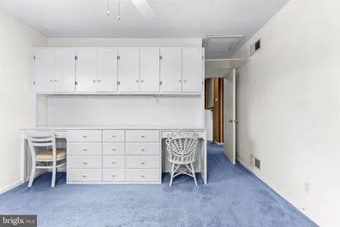 workspace with wooden floor and closet