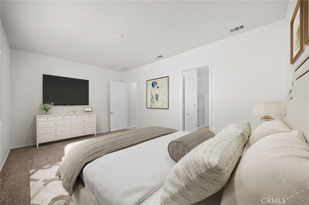 1140 Lantana Road Beaumont, CA 92223 - Photo 15 of 30 a bedroom with a bed and a flat screen tv