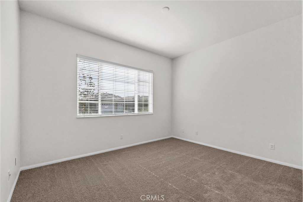 1140 Lantana Road Beaumont, CA 92223 - Photo 20 of 30 an empty room with a window