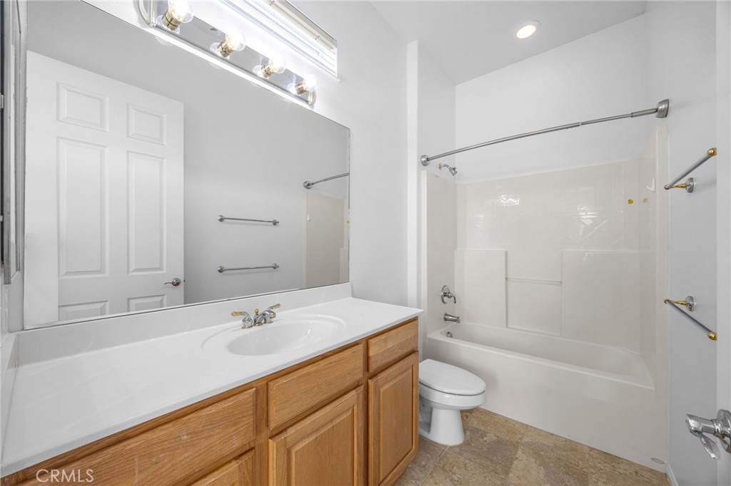 1140 Lantana Road Beaumont, CA 92223 - Photo 22 of 30 a bathroom with a sink a toilet and shower