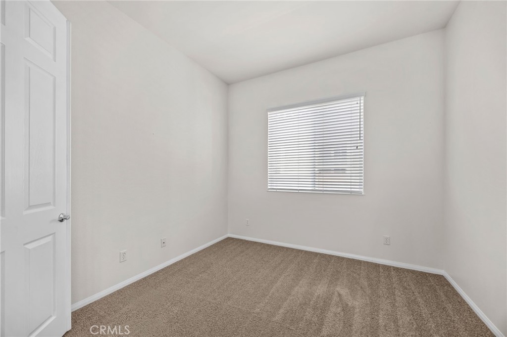 1140 Lantana Road Beaumont, CA 92223 - Photo 23 of 30 an empty room with a window