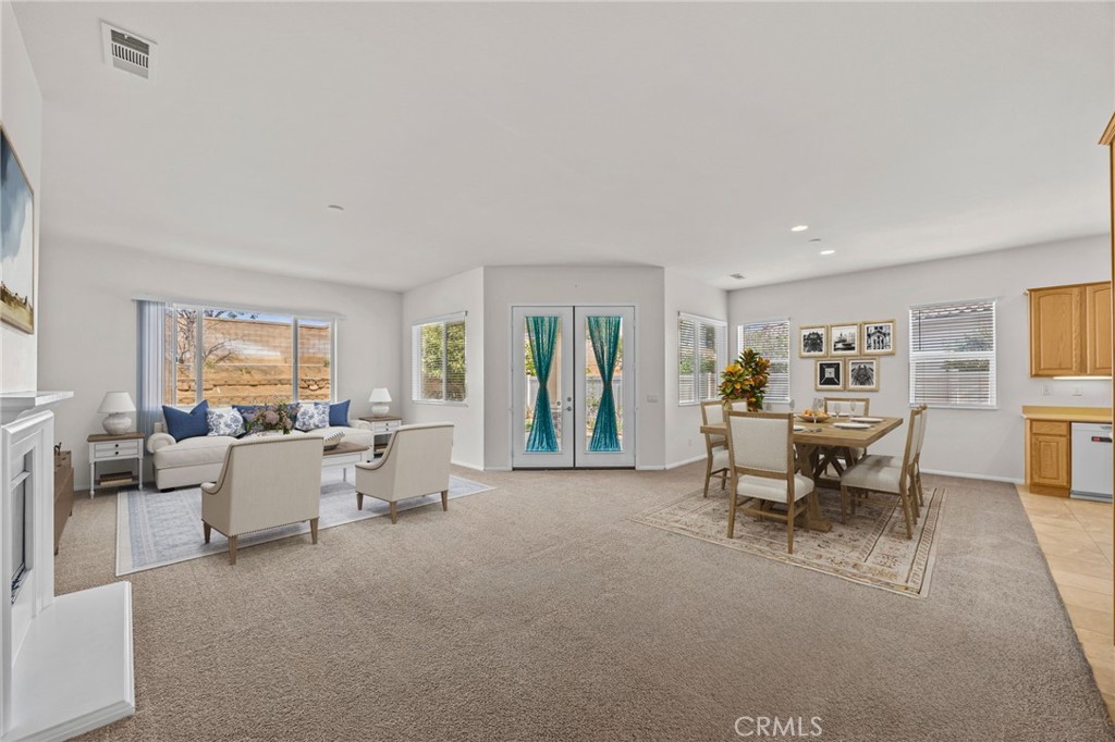 1140 Lantana Road Beaumont, CA 92223 - Photo 8 of 30 a living room with furniture and a large window