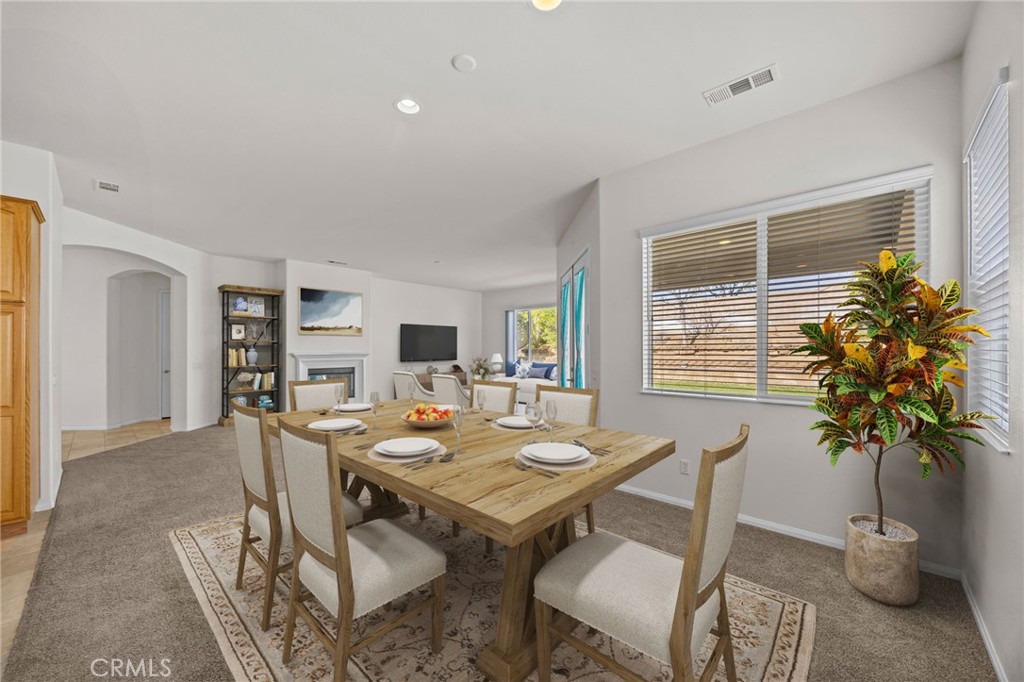 1140 Lantana Road Beaumont, CA 92223 - Photo 10 of 30 a view of a dining room with furniture window and flowerpot
