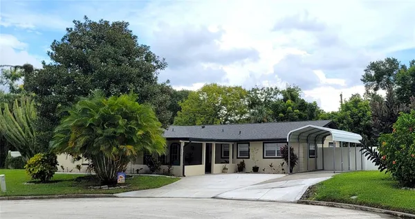 front view of a house with a garden