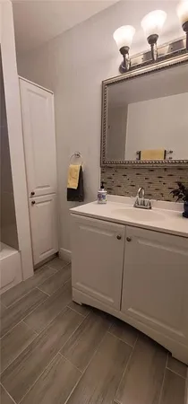 a bathroom with a sink and a mirror