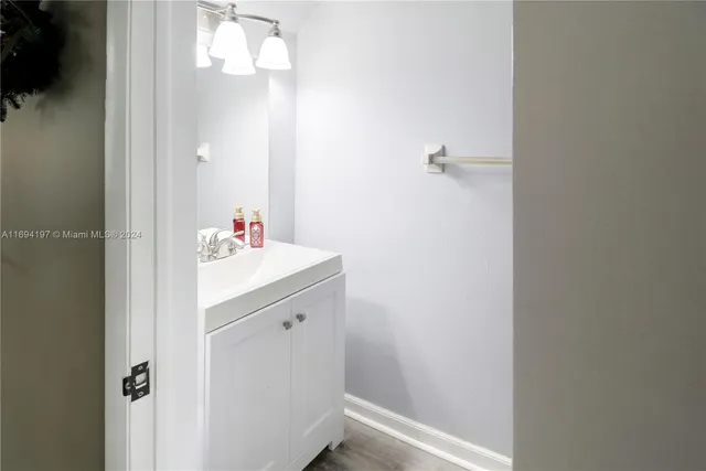 a bathroom with a sink and vanity