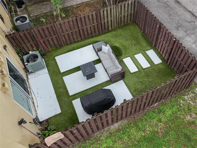 a view of swimming pool with outdoor seating