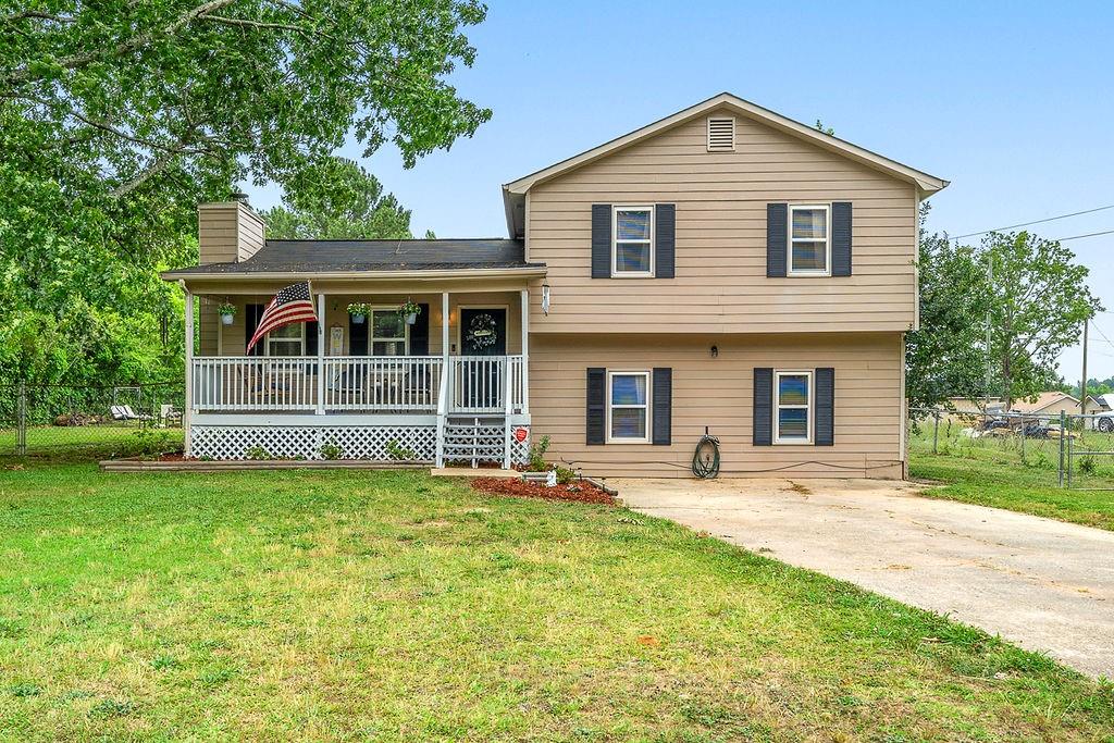 46 Elsberry Road Dallas, GA 30157 - Photo 1 of 1 a front view of house with yard and green space