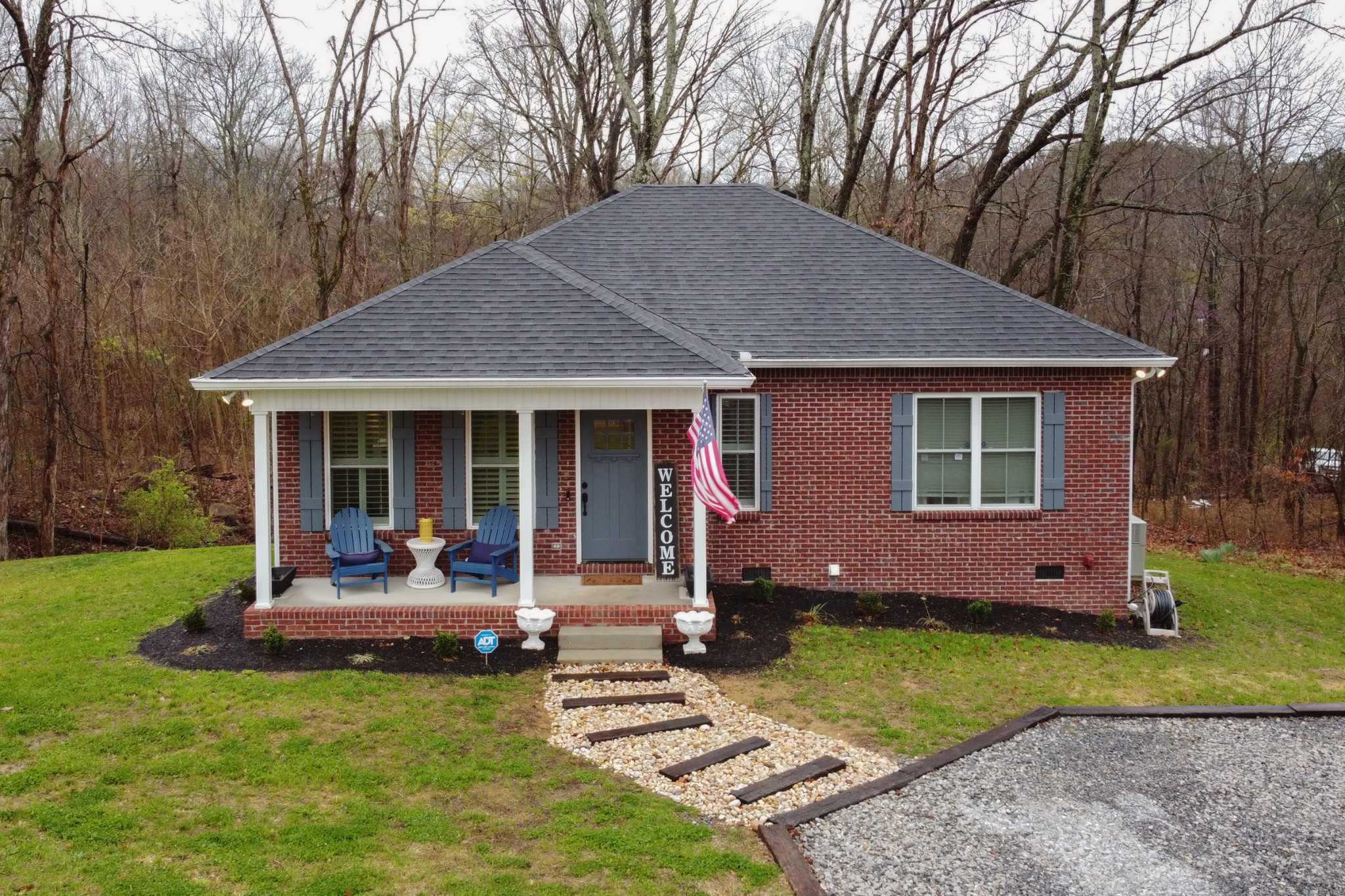 a house that has sitting area in backyard