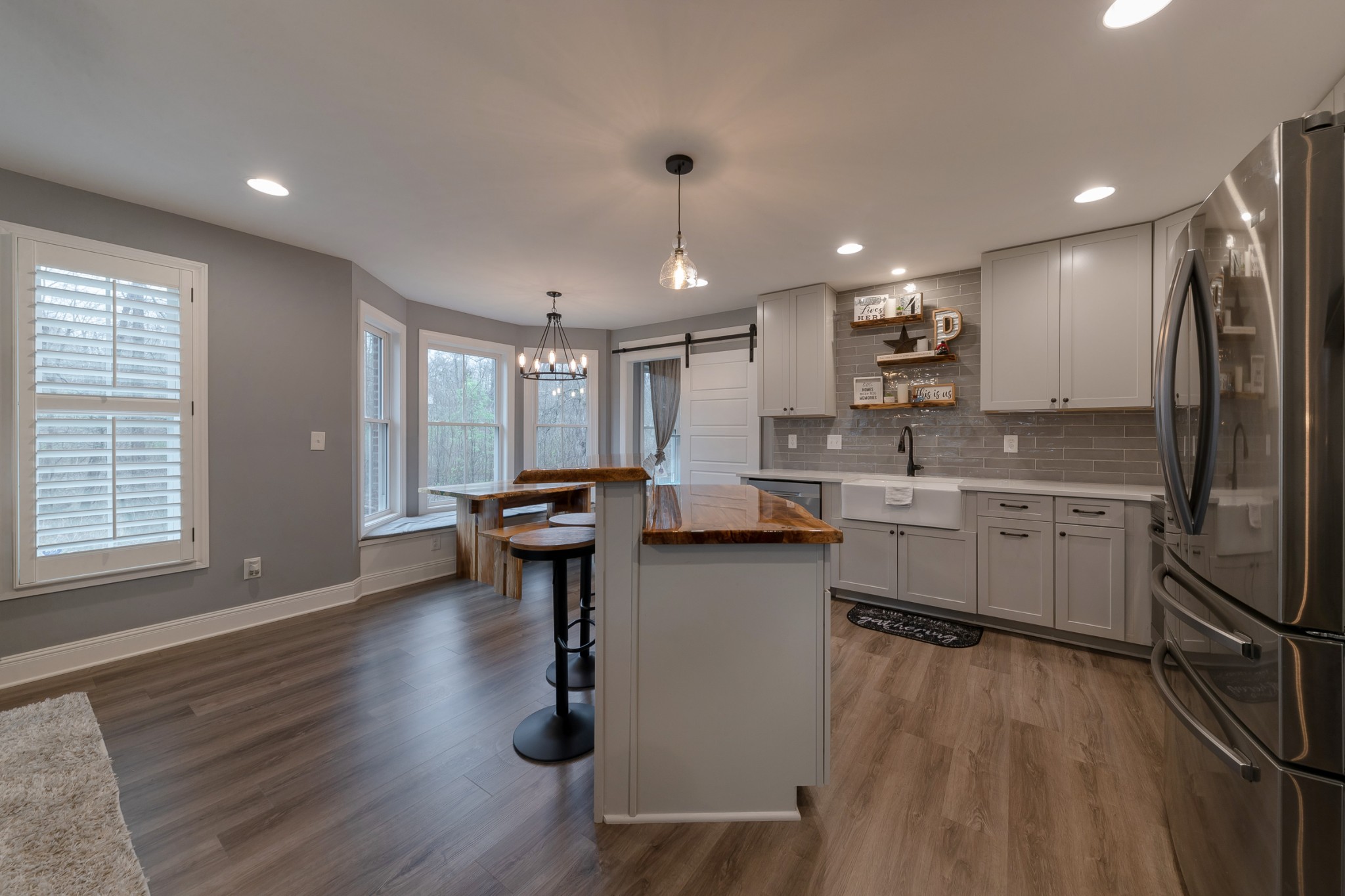 7452 South Swift Road Goodlettsville, TN 37072 - Photo 12 of 37 a kitchen with sink a refrigerator and chairs