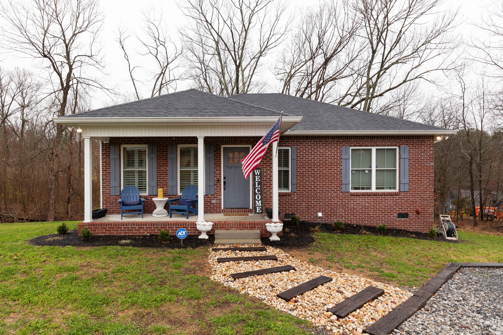 7452 South Swift Road Goodlettsville, TN 37072 - Photo 2 of 37 a house view with a sitting space fire pit and outdoor space