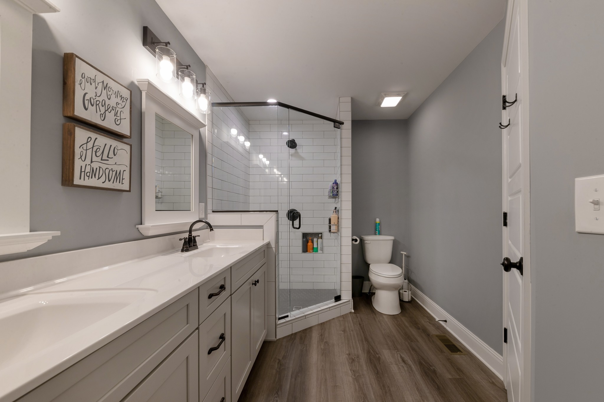 7452 South Swift Road Goodlettsville, TN 37072 - Photo 28 of 37 a bathroom with a double vanity sink toilet and a mirror