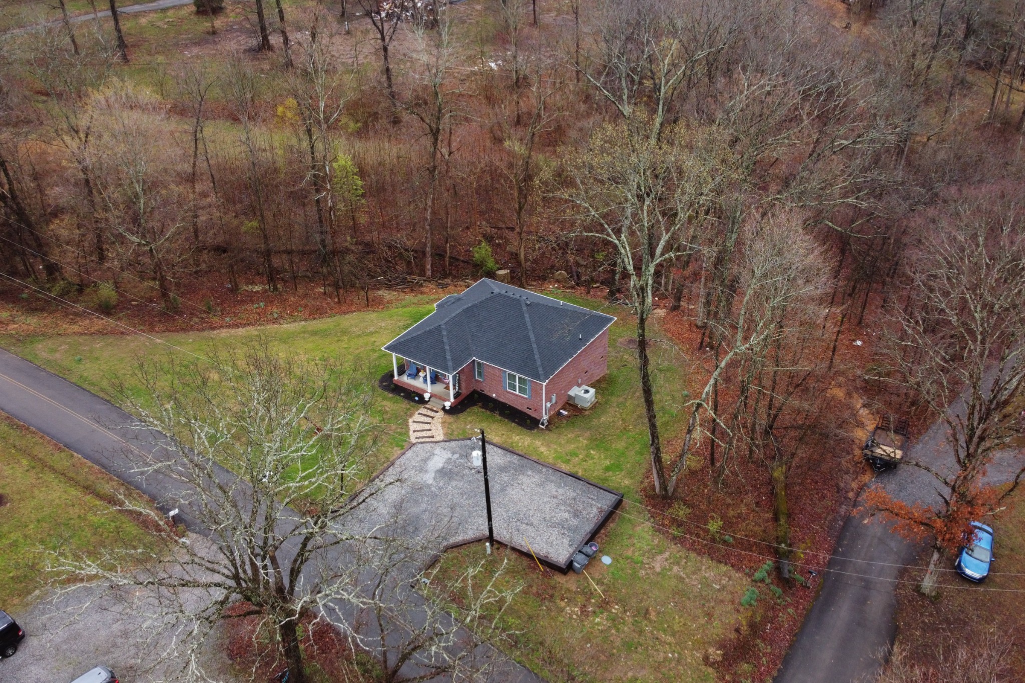 7452 South Swift Road Goodlettsville, TN 37072 - Photo 37 of 37 a view of a backyard with plants and a large tree
