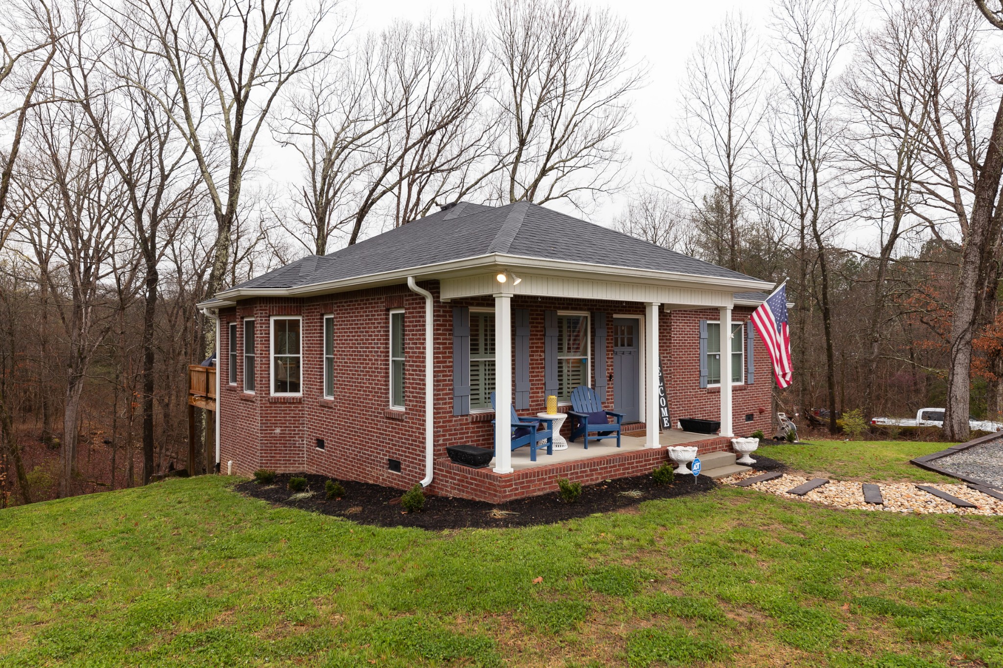 7452 South Swift Road Goodlettsville, TN 37072 - Photo 4 of 37 a view of a house with a yard chairs and large tree