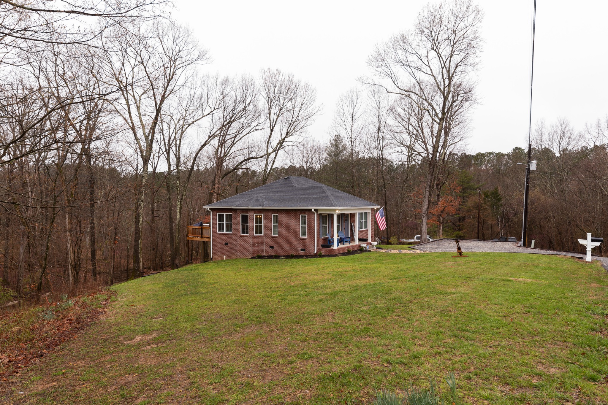 7452 South Swift Road Goodlettsville, TN 37072 - Photo 6 of 37 a view of a house with a big yard and large trees