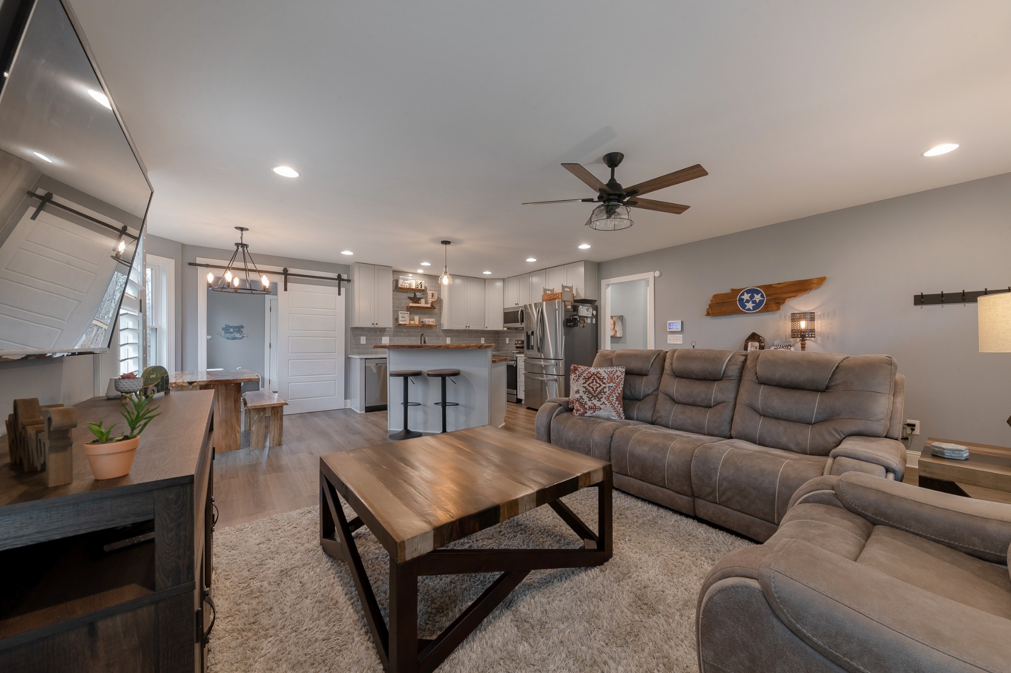 7452 South Swift Road Goodlettsville, TN 37072 - Photo 7 of 37 a living room with furniture a ceiling fan and a rug
