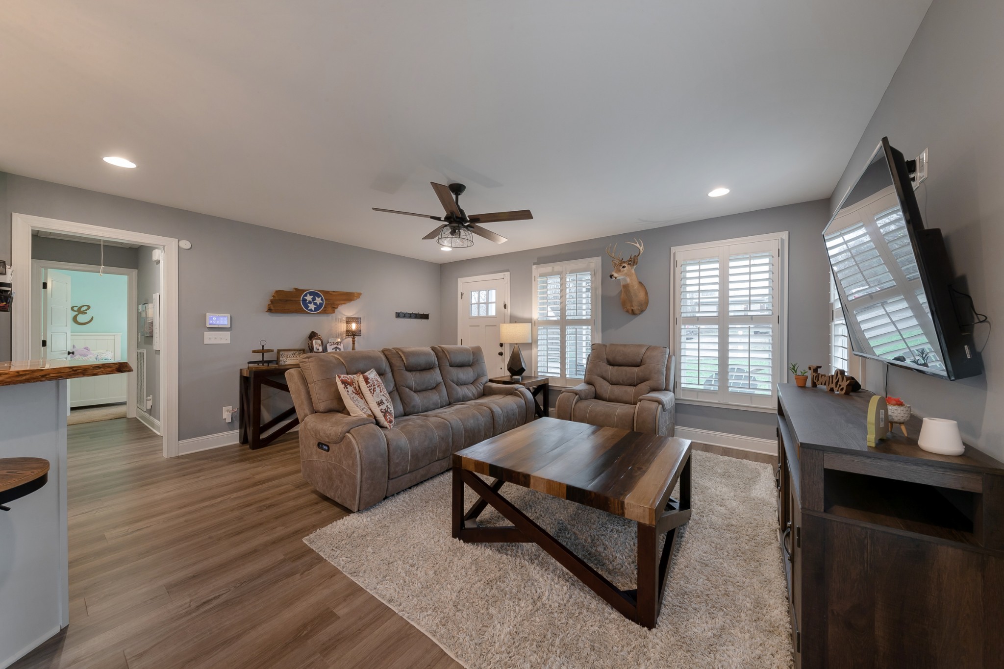 7452 South Swift Road Goodlettsville, TN 37072 - Photo 8 of 37 a living room with furniture and a flat screen tv