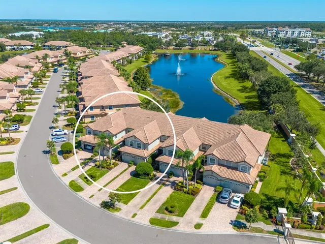 an aerial view of a house with a ocean view