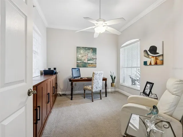 a view of a livingroom with furniture and windows