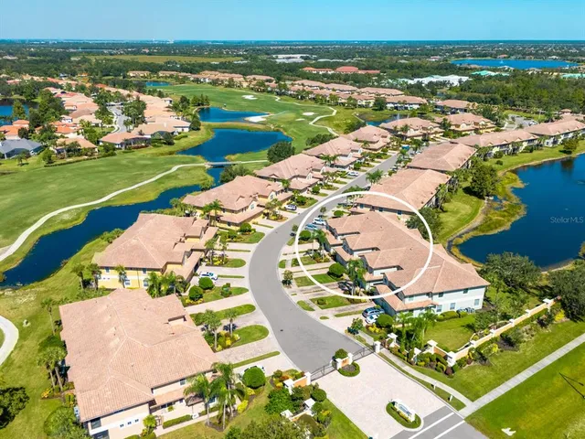 an aerial view of a house with a ocean view
