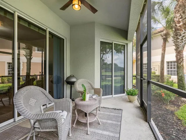 a view of a house with backyard and porch